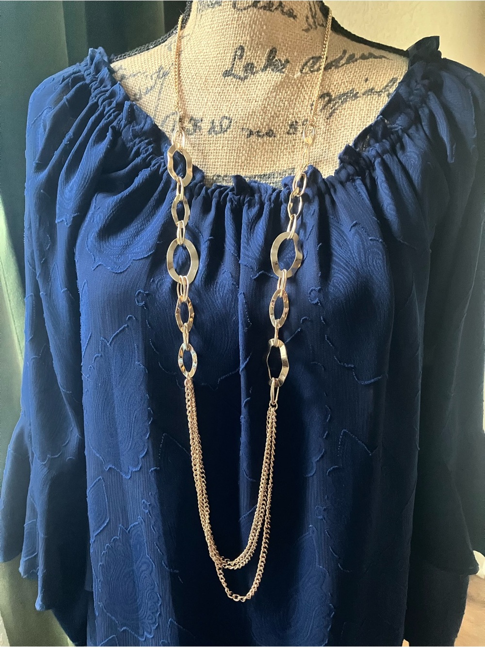 Long gold necklace with hammered links and chain